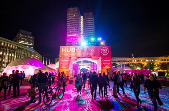 Crowd in front of HUBweek entrance with tents and lights