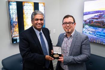 Omer Tanovic (right) receives award