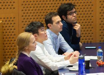 conference attendees listen to a speaker