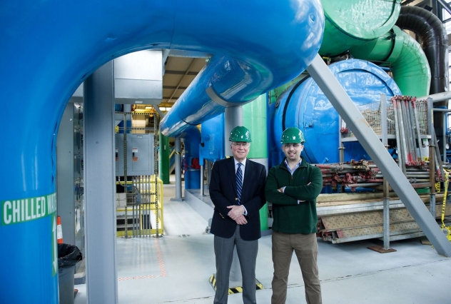 Using their “Cybersafety” methodology, Professor Stuart Madnick (left), graduate student Shaharyar Khan (right), and Professor James Kirtley Jr. (not pictured) identified several cyber vulnerabilities in a small power plant, including a system that poses a risk because it relies on software rather than mechanical safety devices to keep turbines from spinning out of control. Photo: Stuart Darsch